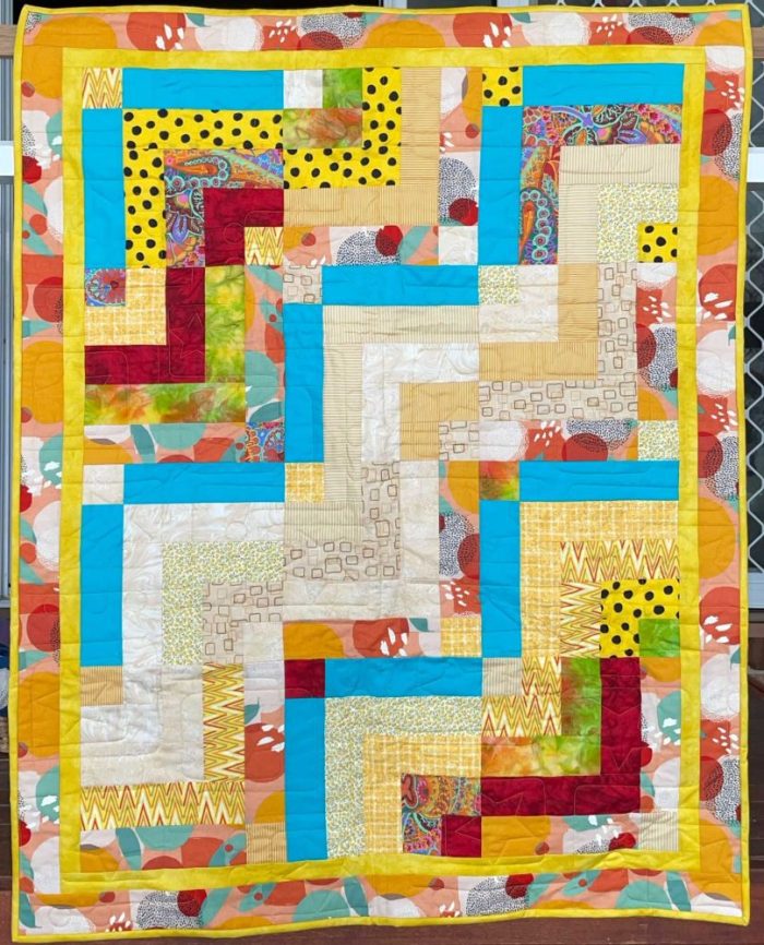 Bright Quarter Log Cabin Quilt